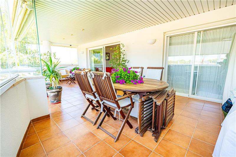Apartment with a terrace of approx. 32 m² offering views of the forest, in a residential complex with swimming pools